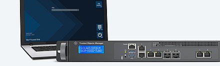 Laptop with the R&S®Trusted Disk login screen and the R&S®Trusted Objects Manager management appliance. The screen shows PIN entry for smartcard-based authentication.