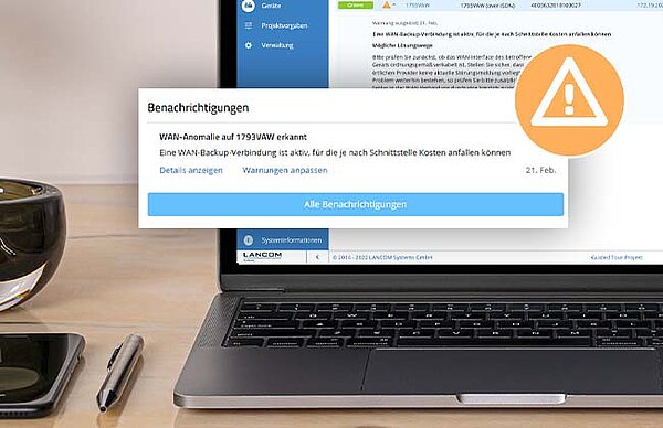 Laptop mit Screenshot der R&S®LMC und Warndreieck