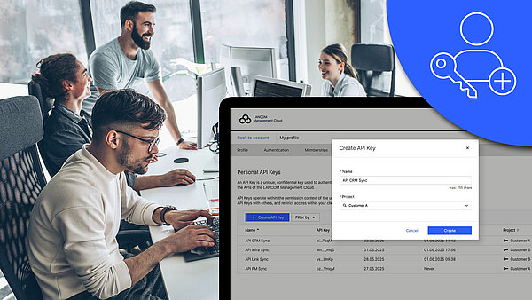 Image with focus on screenshot of the new API application on a monitor, icon, and people in the office in the background