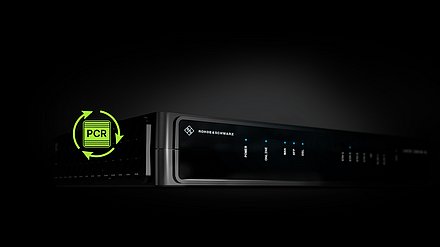 Black CPE housing from R&S Networks and Cybersecurity on a black background with a green icon containing PCR.