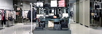 Fashion store with rented sales space for a shop-in-shop shelf of a brand bag manufacturer