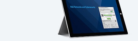 Bannerbild mit aufgestelltem MacBook, auf dem die Bedienoberfläche des LANCOM Trusted Access Clients zu sehen ist