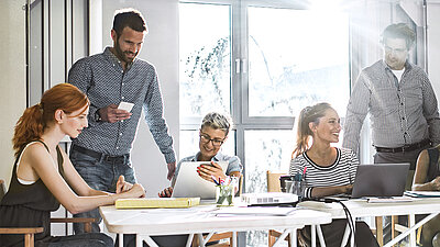 People discussing at a desk