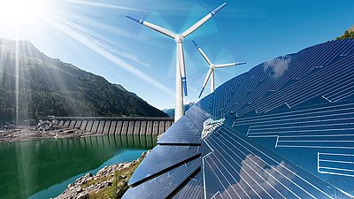 Solar panels, wind turbines and a dam beside a mountain lake represent renewable energy.
